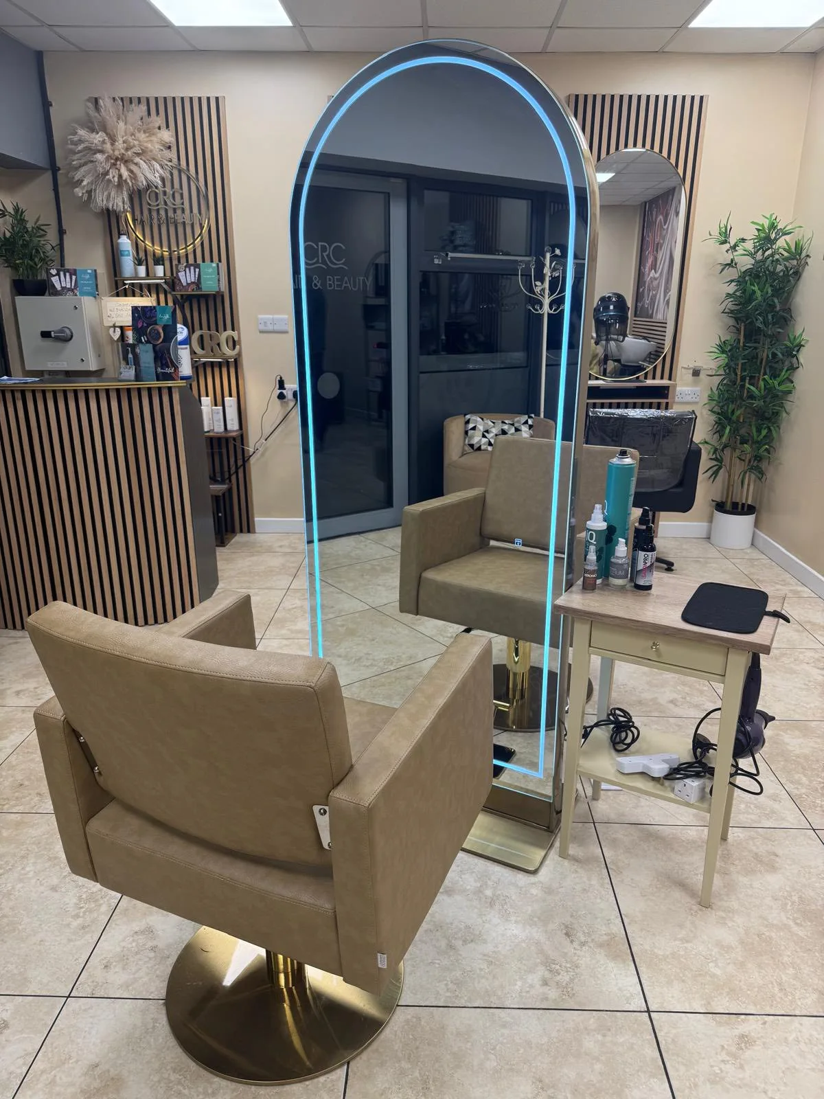 Styling chair and arched mirror inside CRC Hair & Beauty